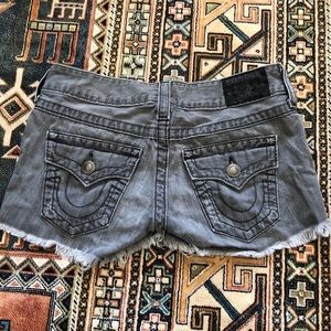 Black jean shorts with raw hem